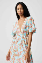 Women’s floral sundress in light blue and pink with a deep V-neck and flowy fit, lightweight summer dress from Duck Apparel South Africa
