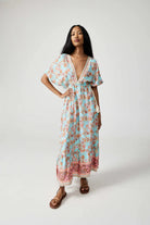 Women’s floral sundress in light blue and pink with a deep V-neck and flowy fit, lightweight summer dress from Duck Apparel South Africa
