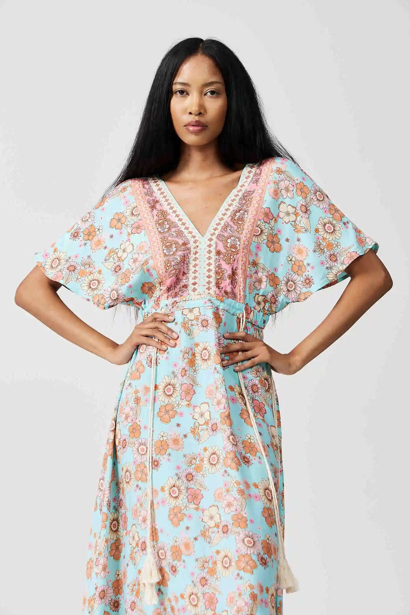 Women’s floral sundress in light blue and pink with a deep V-neck and flowy fit, lightweight summer dress from Duck Apparel South Africa