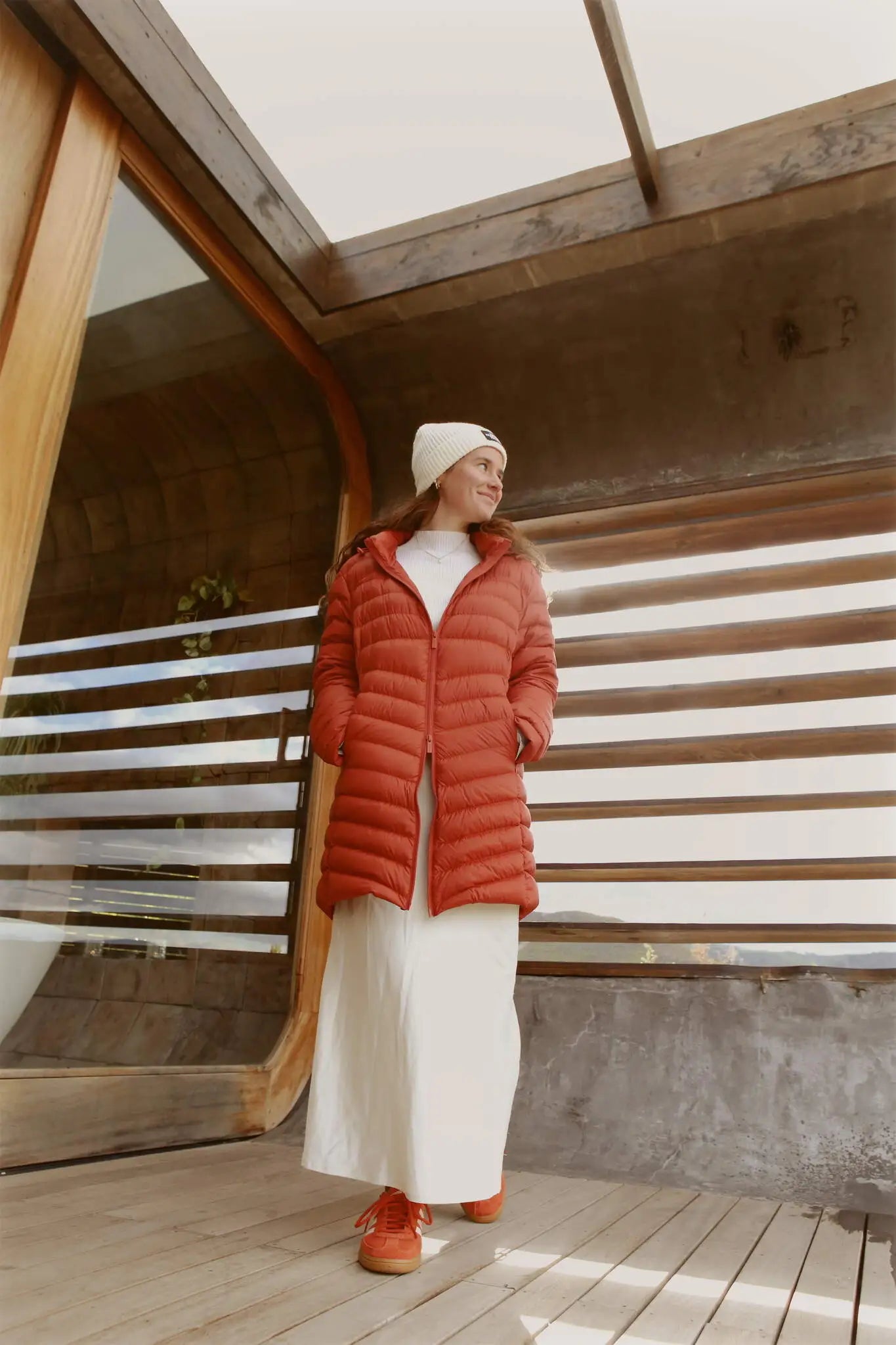 Women’s insulated hooded parka in rust red, designed for warmth and comfort in South Africa’s winter season — Rust Classic Parka™