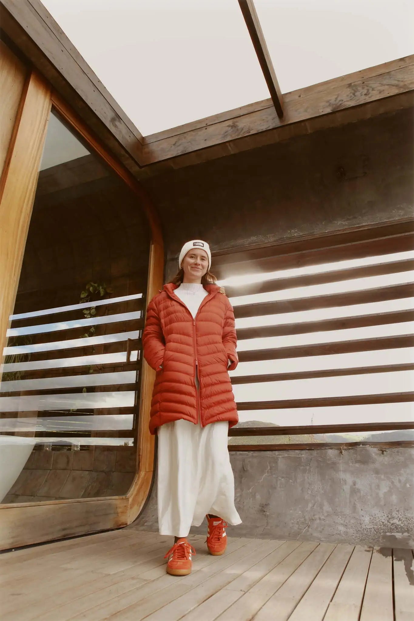 Women’s insulated hooded parka in rust red, designed for warmth and comfort in South Africa’s winter season — Rust Classic Parka™