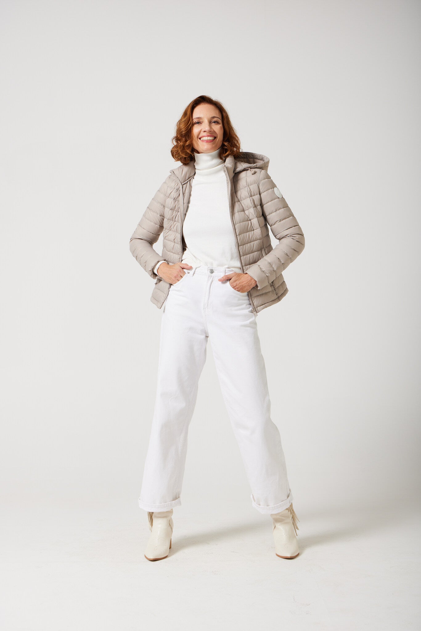 Women’s Latte Classic Jacket™ in a soft beige shade, lightweight puffer jacket with hood, perfect for layering during cool South African weather