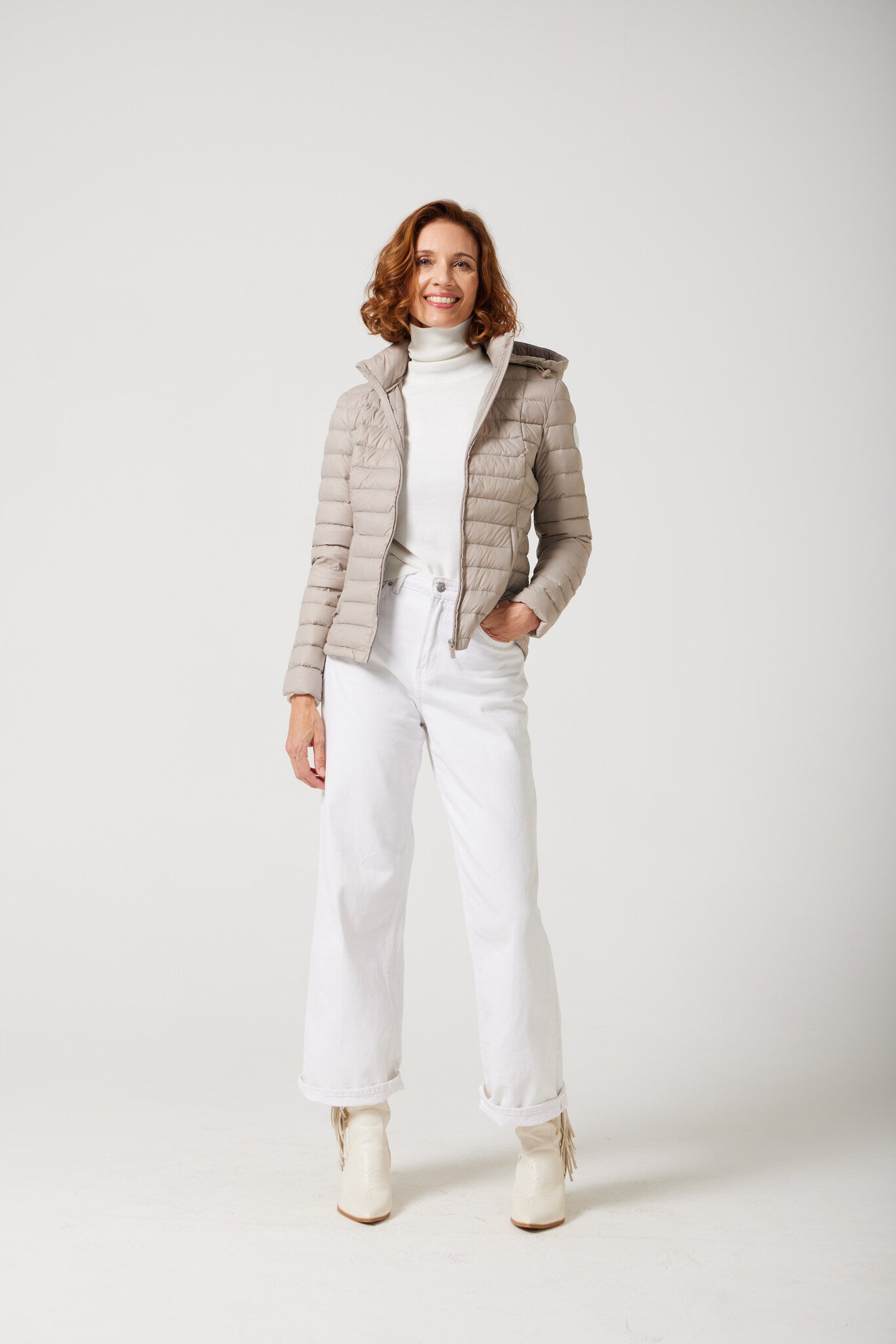 Women’s Latte Classic Jacket™ in a soft beige shade, lightweight puffer jacket with hood, perfect for layering during cool South African weather