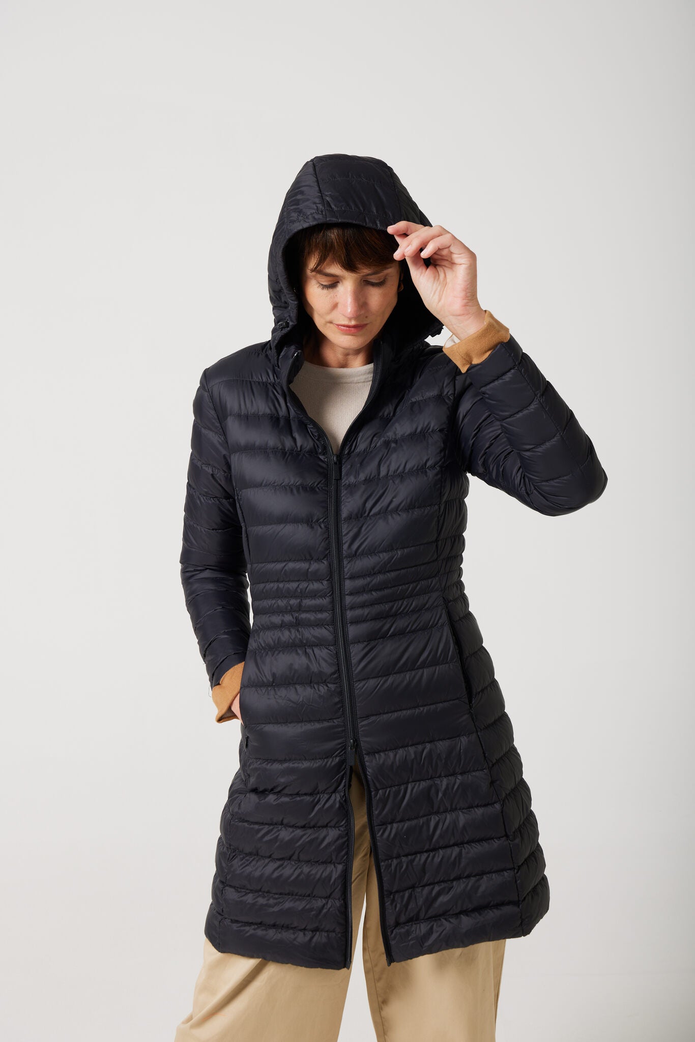 Women’s insulated midi-length hooded parka in midnight black, designed for warmth and comfort in South Africa’s winter season — Midnight Midi Parka™