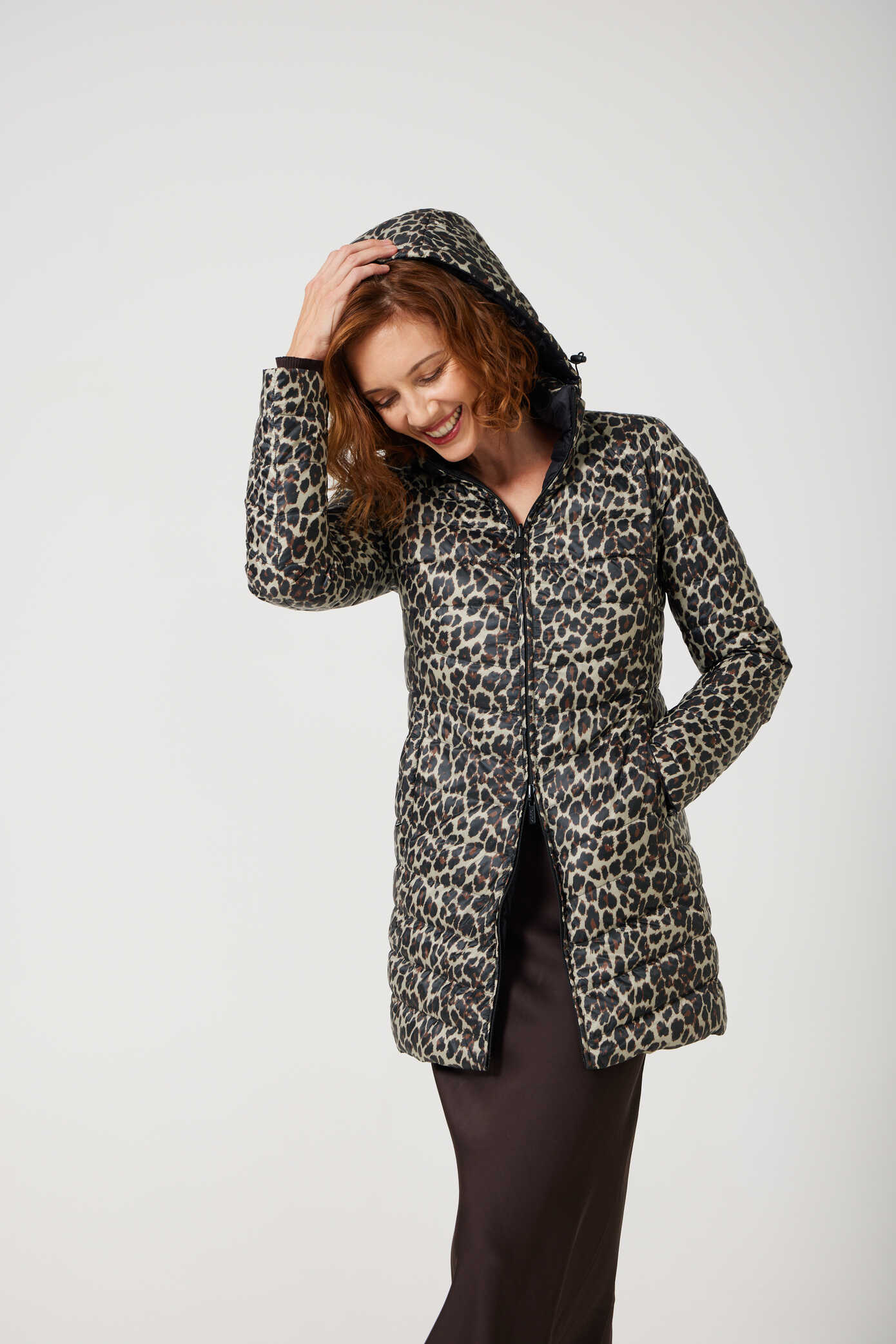 Women’s insulated reversible hooded parka in leopard print and midnight black, designed for warmth and comfort in South Africa’s winter season — Midnight x Leopard Classic Parka™