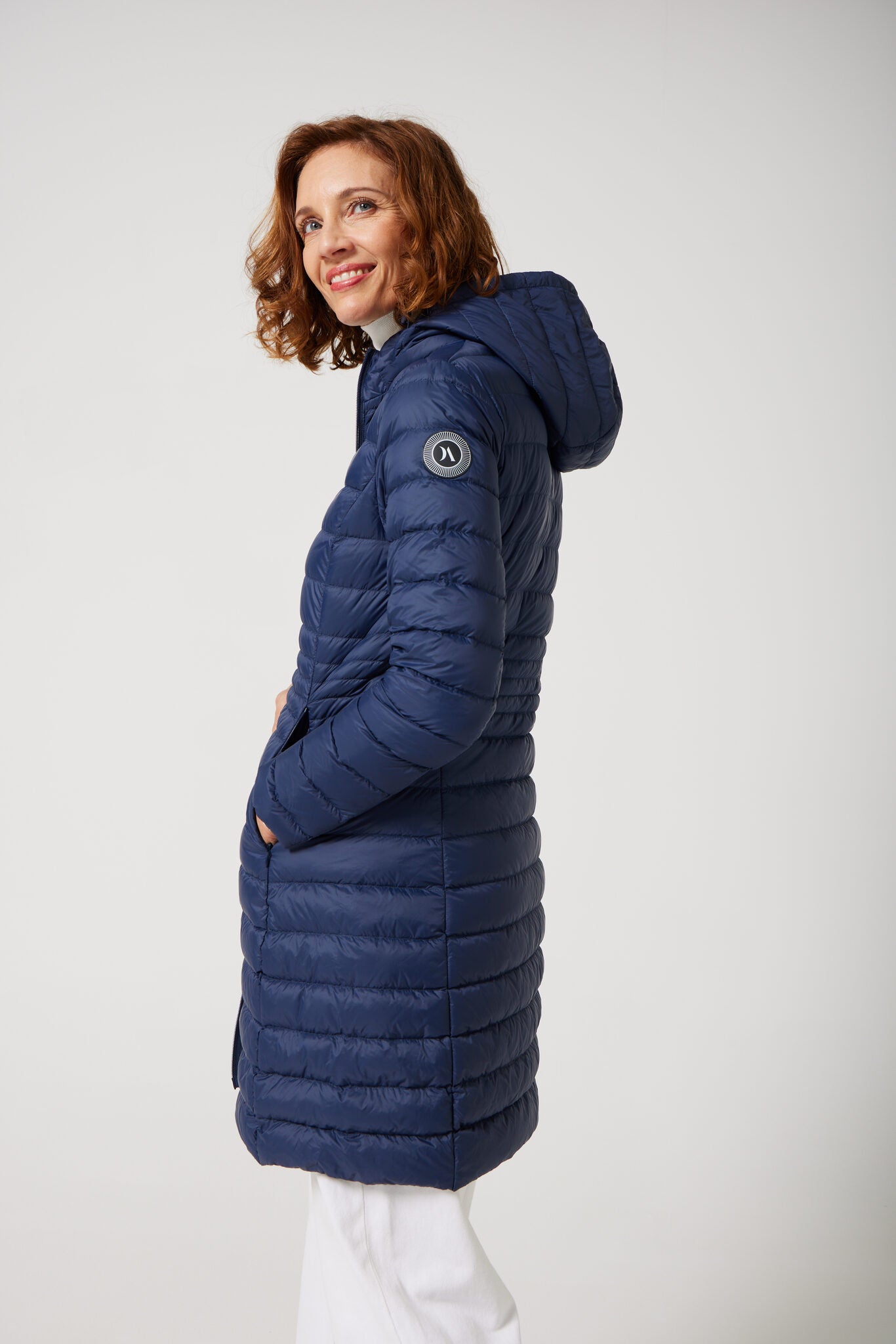 Women’s insulated midi-length hooded parka in navy blue, designed for warmth and comfort in South Africa’s winter season — Navy Midi Parka™