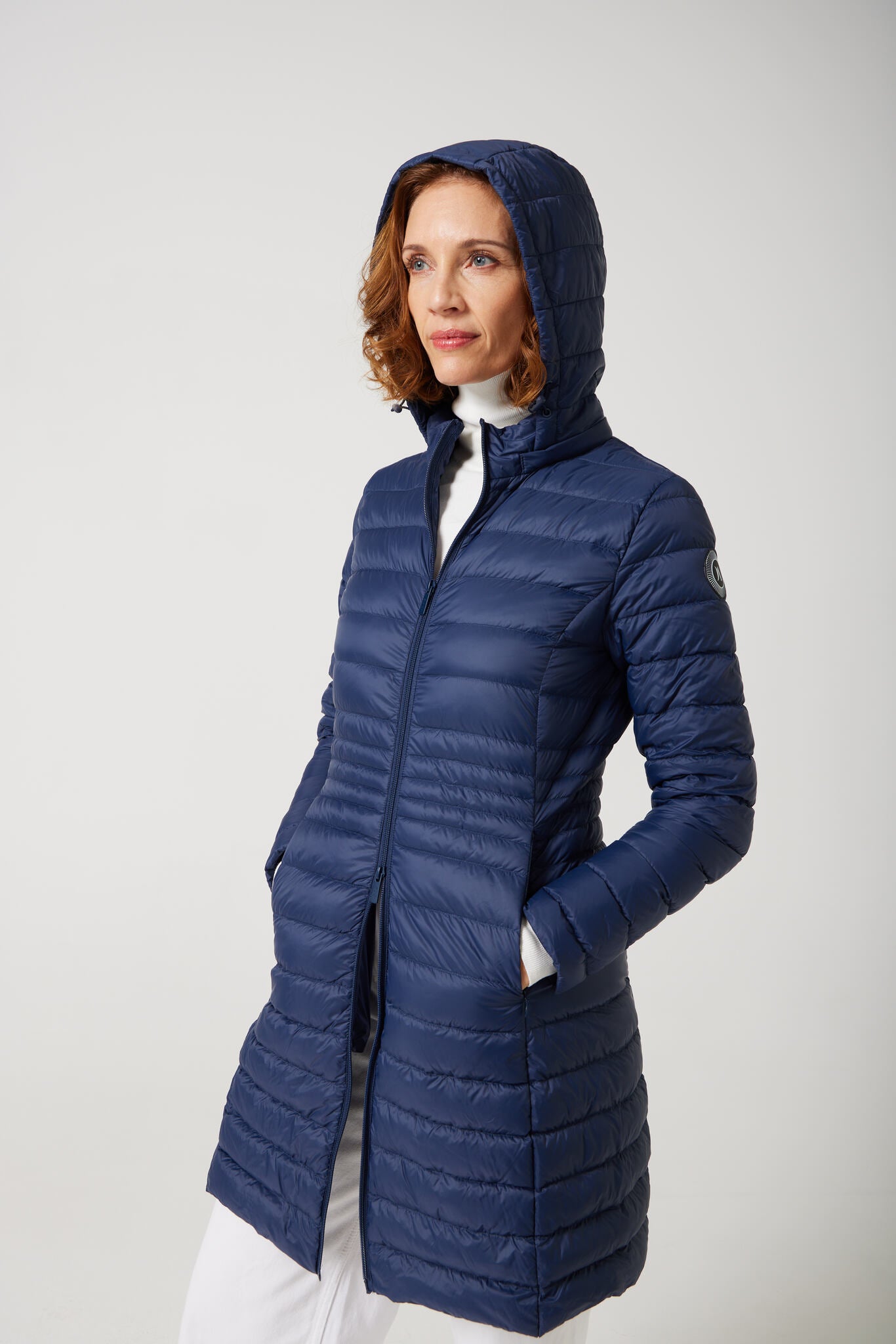 Women’s insulated midi-length hooded parka in navy blue, designed for warmth and comfort in South Africa’s winter season — Navy Midi Parka™