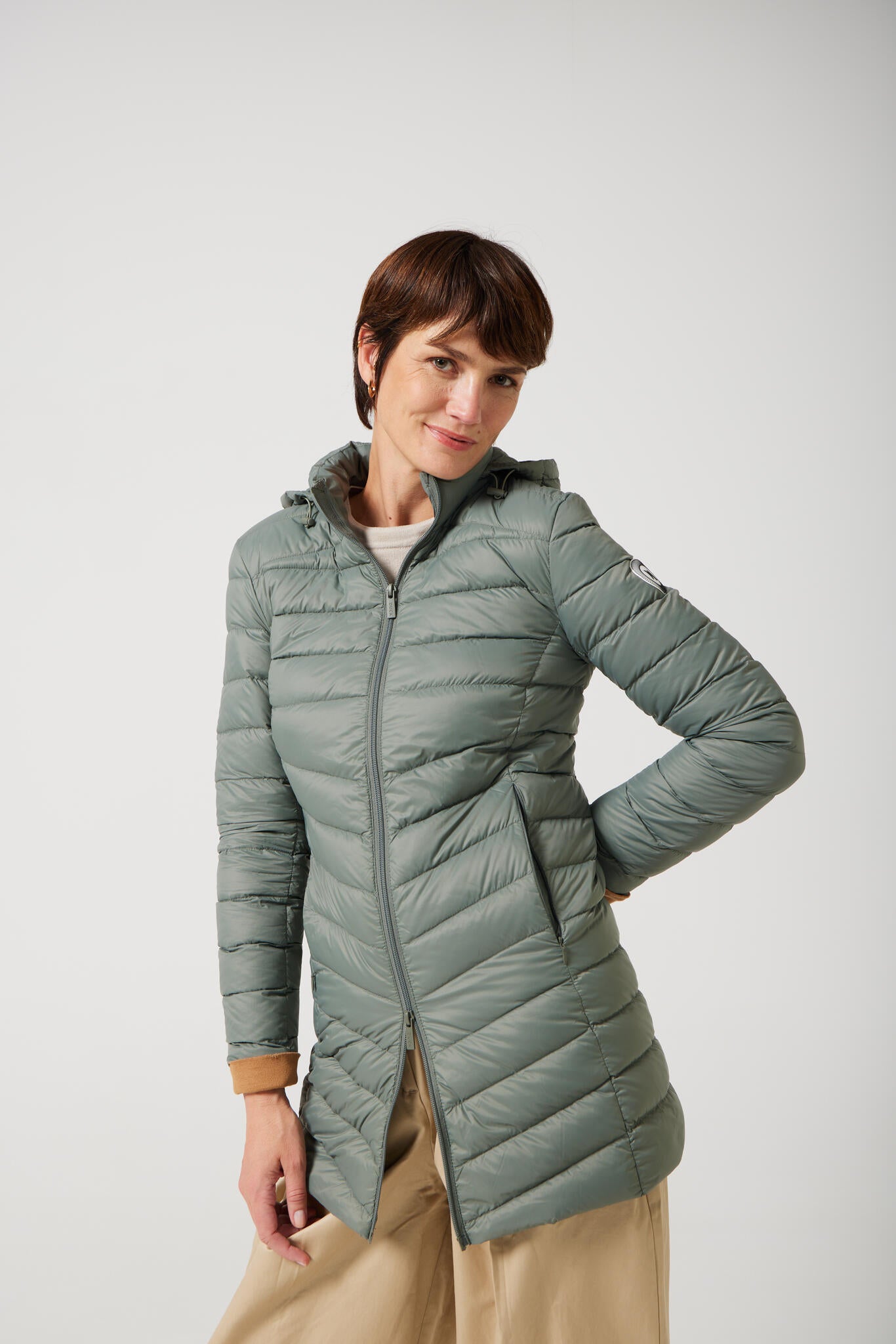 Women’s insulated hooded parka in sage green, designed for warmth and comfort in South Africa’s winter season — Sage Classic Parka™