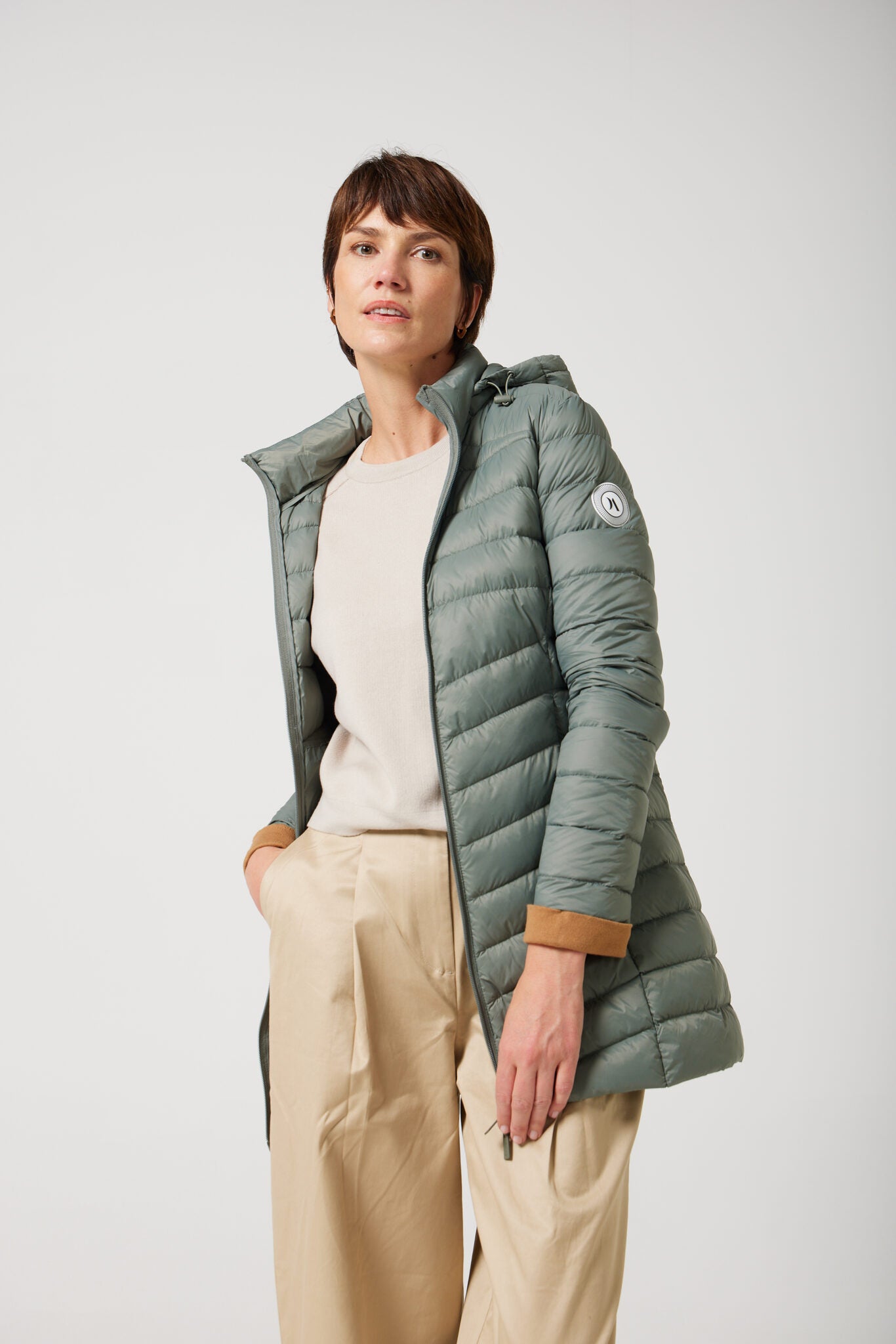 Women’s insulated hooded parka in sage green, designed for warmth and comfort in South Africa’s winter season — Sage Classic Parka™
