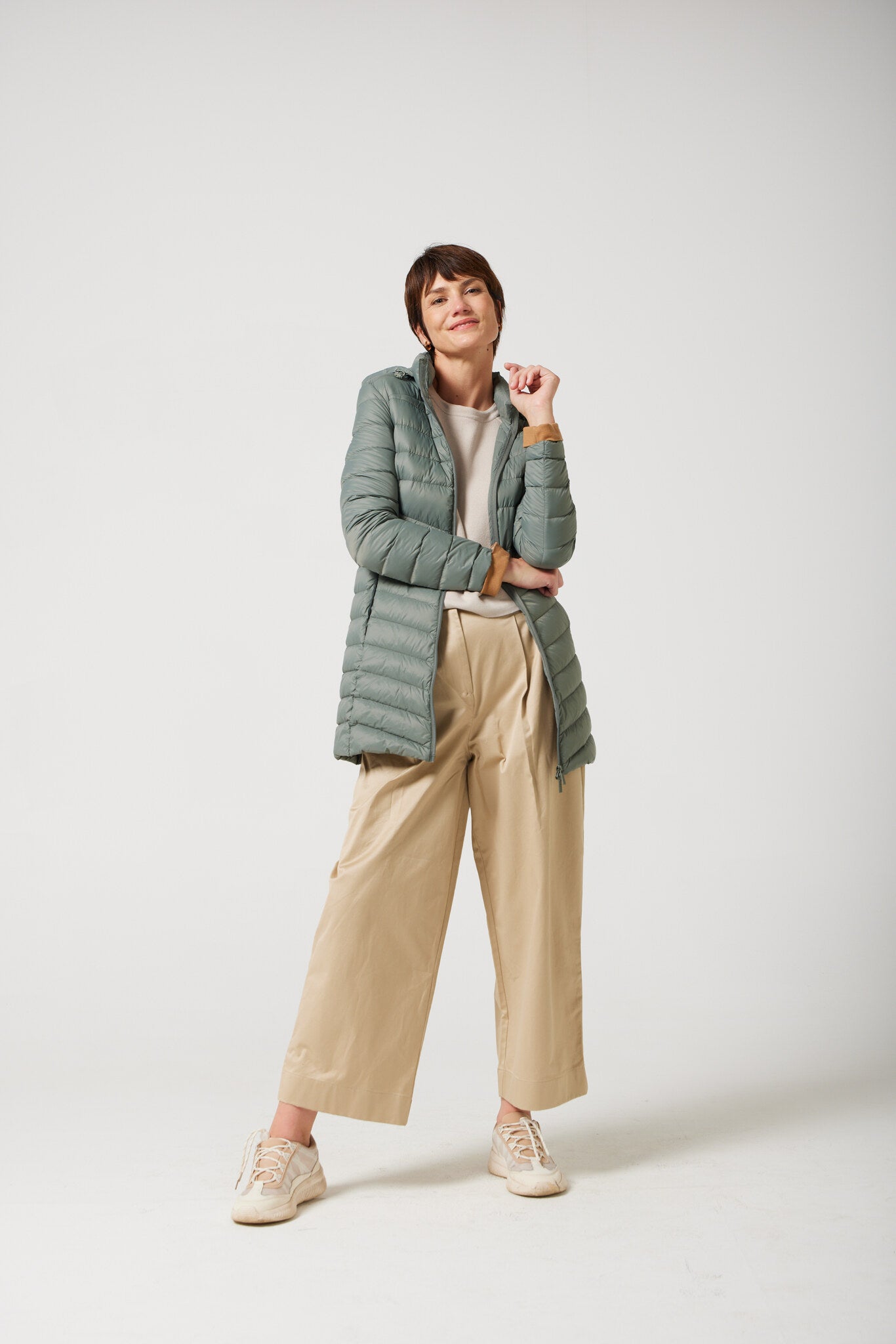 Women’s insulated hooded parka in sage green, designed for warmth and comfort in South Africa’s winter season — Sage Classic Parka™