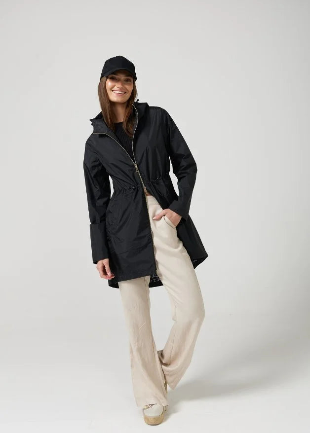 The Highland Midnight raincoat in classic black, lightweight hooded waterproof raincoat ideal for South Africa’s rainy season and wet climate