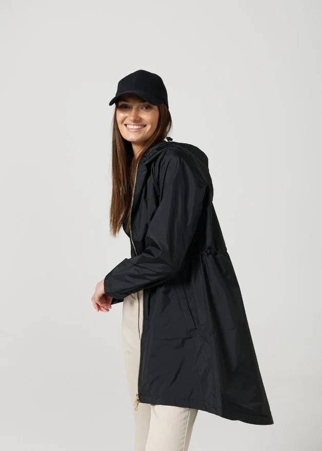 The Highland Midnight raincoat in classic black, lightweight hooded waterproof raincoat ideal for South Africa’s rainy season and wet climate