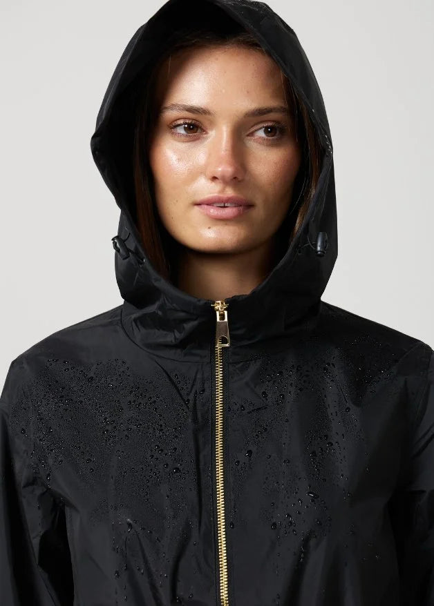 The Highland Midnight raincoat in classic black, lightweight hooded waterproof raincoat ideal for South Africa’s rainy season and wet climate