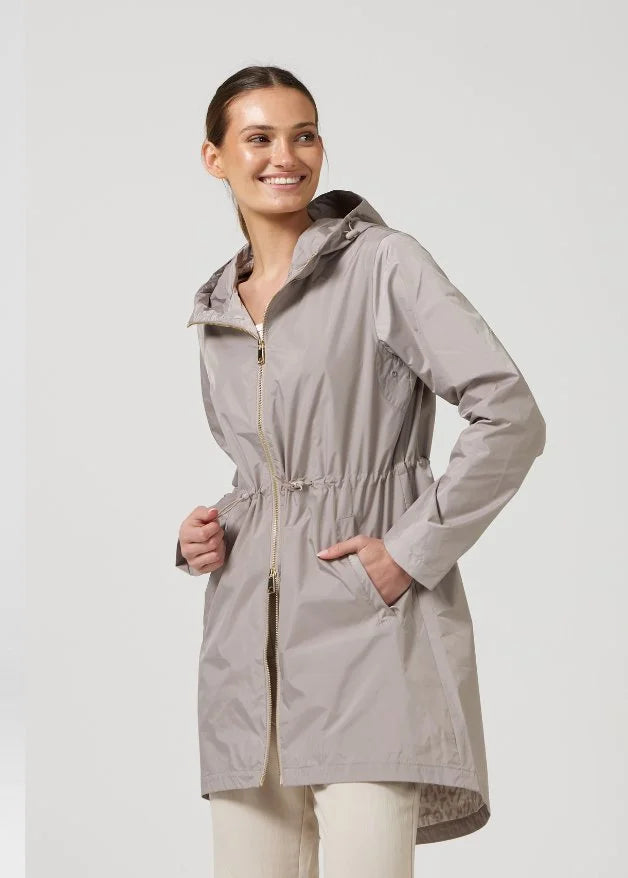 The Cairo Sands raincoat in beige, lightweight hooded waterproof raincoat ideal for South Africa’s rainy season and wet climate