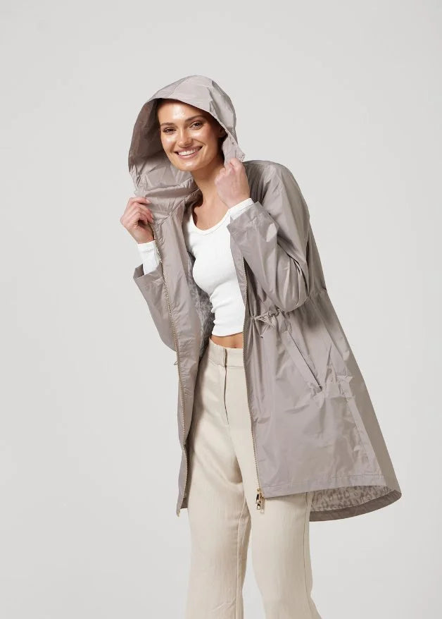 The Cairo Sands raincoat in beige, lightweight hooded waterproof raincoat ideal for South Africa’s rainy season and wet climate