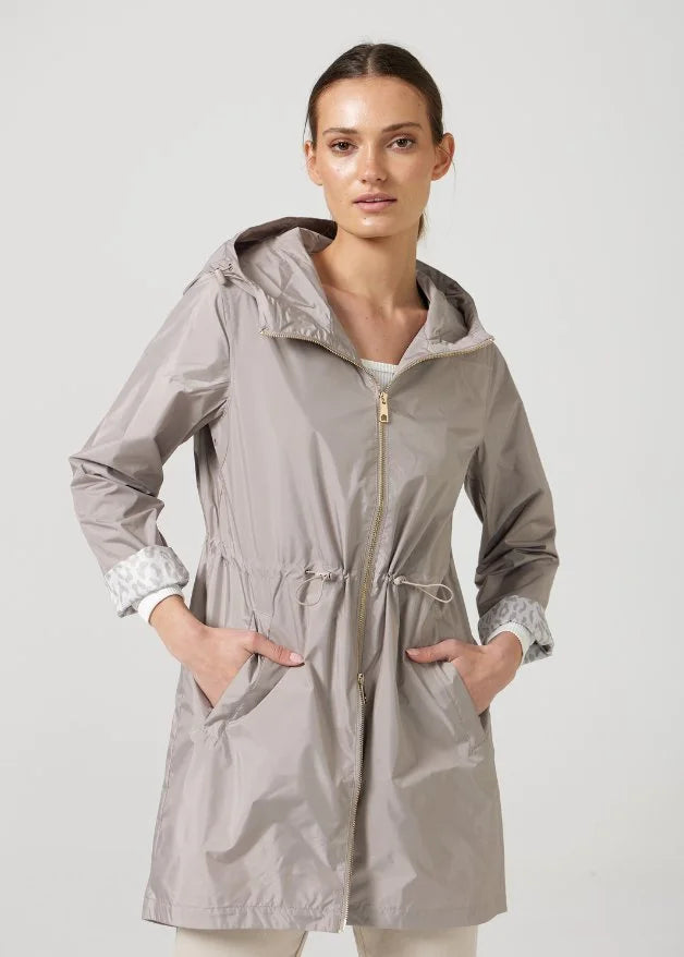 The Cairo Sands raincoat in beige, lightweight hooded waterproof raincoat ideal for South Africa’s rainy season and wet climate