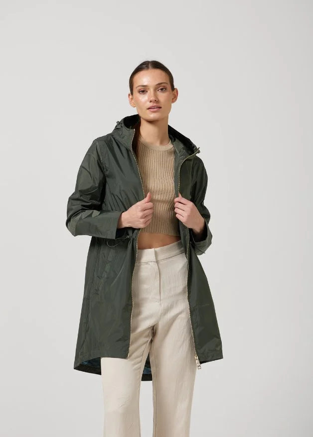 The Juniper raincoat in deep green, lightweight hooded waterproof raincoat ideal for South Africa’s rainy season and wet climate