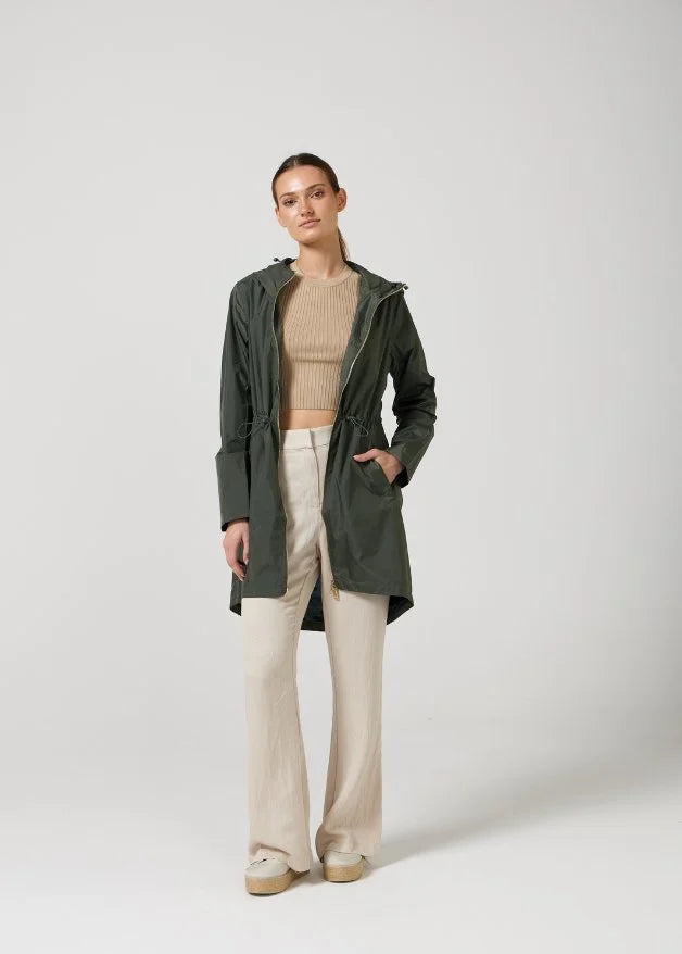 The Juniper raincoat in deep green, lightweight hooded waterproof raincoat ideal for South Africa’s rainy season and wet climate