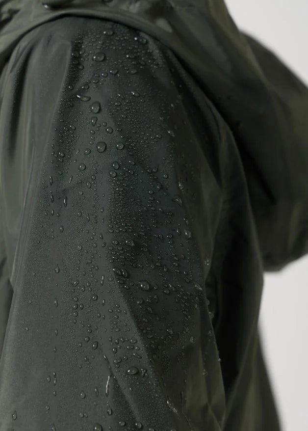 The Juniper raincoat in deep green, lightweight hooded waterproof raincoat ideal for South Africa’s rainy season and wet climate
