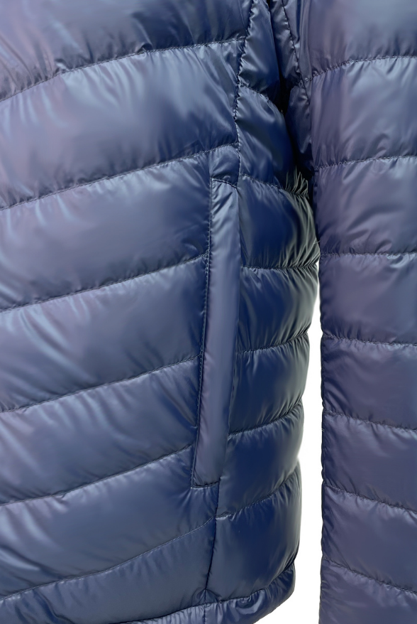 Close up of the pocket of a reversible Black and Navy Mens Duck Down puffer jacket